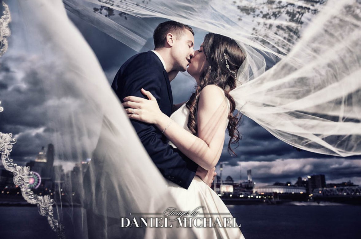 Daniel Michael capturing a romantic moment under veil at a Cincinnati wedding